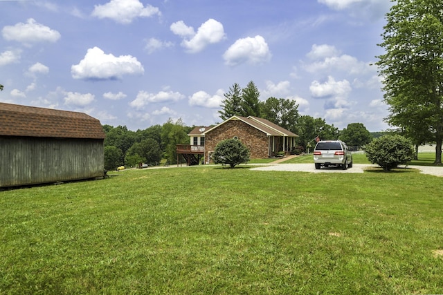 535 Dawson Rd, Cumberland Furnace, TN 37051 - view of grassy yard with driveway and an outbuilding