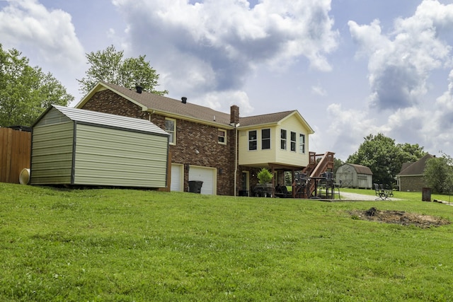 535 Dawson Rd, Cumberland Furnace, TN 37051 - back of property featuring brick siding, a storage shed, a chimney, a garage, and a yard