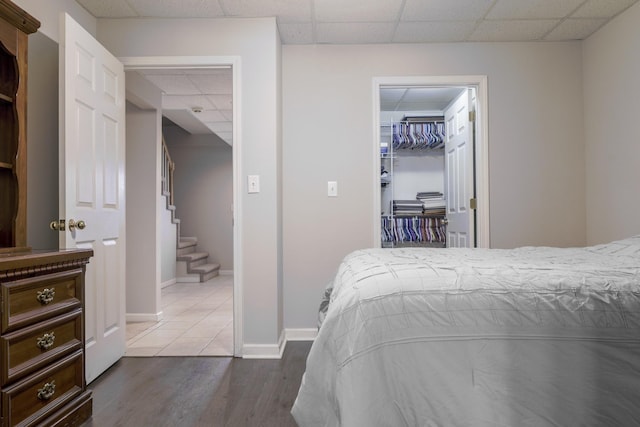 535 Dawson Rd, Cumberland Furnace, TN 37051 - bedroom with a paneled ceiling, wood finished floors, a walk in closet, and a closet