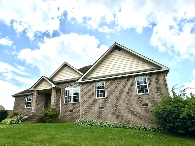 309 Caydras Way, Lafayette, TN 37083 - view of front facade with crawl space, a front yard, and brick siding