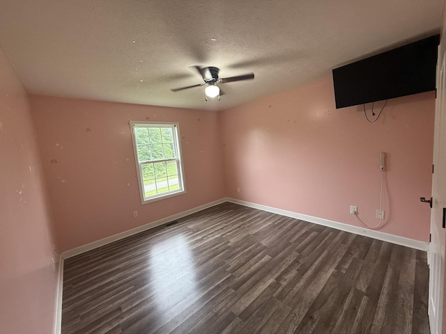 309 Caydras Way, Lafayette, TN 37083 - unfurnished room with dark wood-type flooring, ceiling fan, a textured ceiling, and baseboards