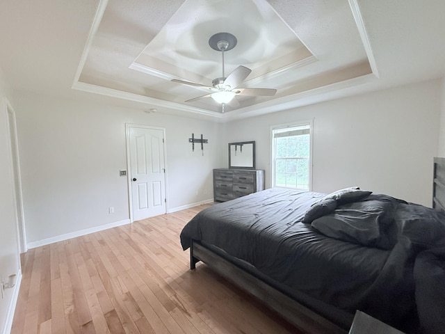 309 Caydras Way, Lafayette, TN 37083 - bedroom featuring a tray ceiling, light wood finished floors, baseboards, and a ceiling fan