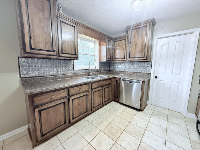 309 Caydras Way, Lafayette, TN 37083 - kitchen with dishwasher, a sink, backsplash, dark countertops, and a textured ceiling