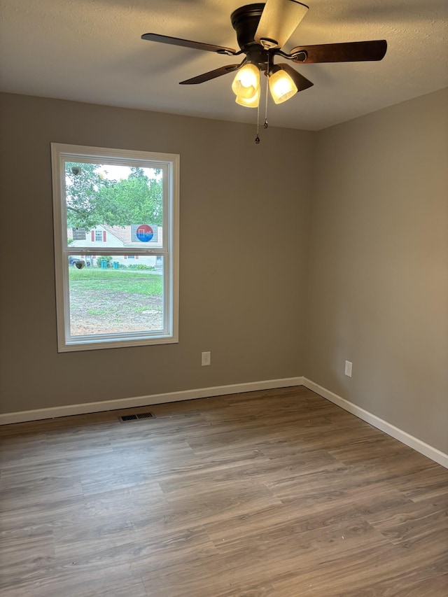 615 6th Ave N, Lewisburg, TN 37091 - empty room with ceiling fan, wood finished floors, and baseboards