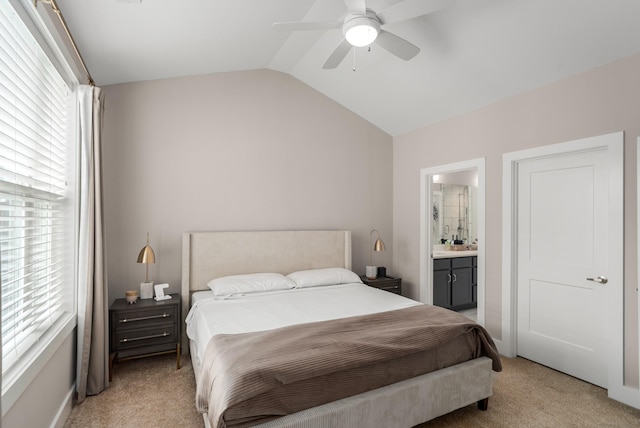 507 Vernon Cir, Nashville, TN 37209 - bedroom featuring light colored carpet, vaulted ceiling, ensuite bath, and a ceiling fan