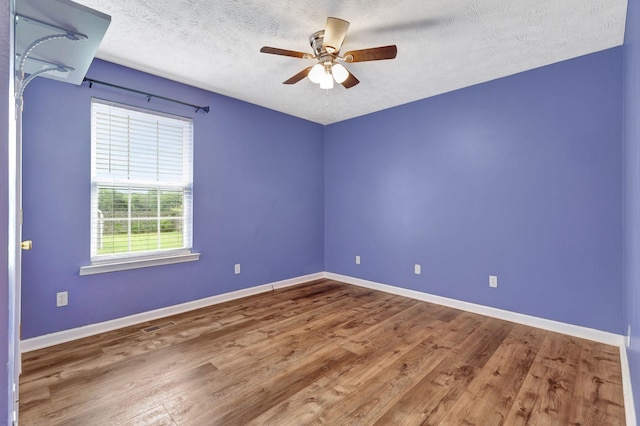 2312 Forrest Fields Dr, Chapel Hill, TN 37034 - spare room featuring wood finished floors, ceiling fan, baseboards, and a textured ceiling