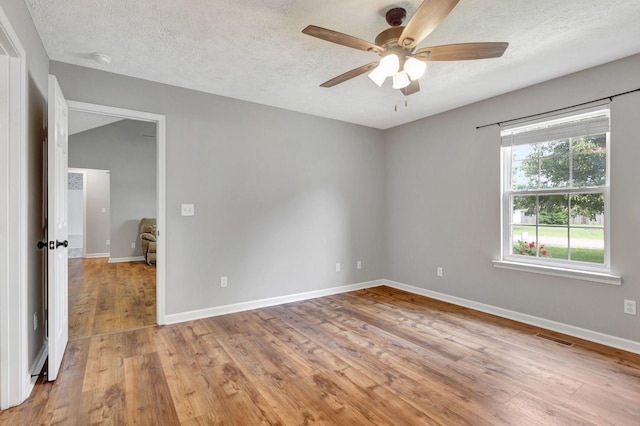 2312 Forrest Fields Dr, Chapel Hill, TN 37034 - empty room featuring ceiling fan, light wood-style floors, a textured ceiling, and baseboards