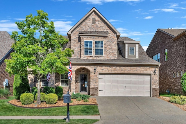 1727 Foxland Blvd, Gallatin, TN 37066 - view of front of house featuring driveway, stone siding, and a shingled roof