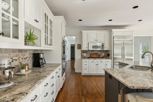 6321 Wescates, Brentwood, TN 37027 - kitchen with a sink, stainless steel appliances, dark wood-type flooring, white cabinetry, and light stone countertops