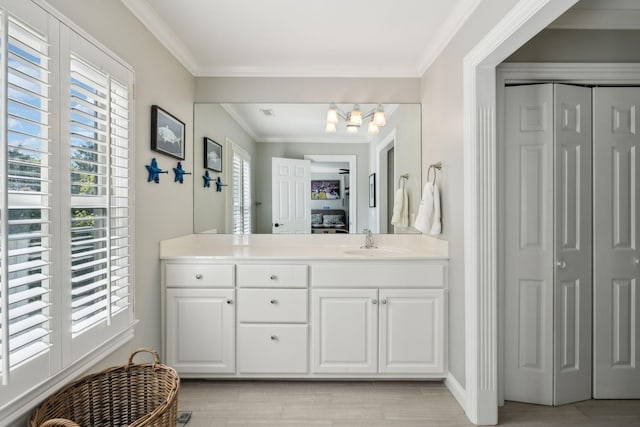 6321 Wescates, Brentwood, TN 37027 - ensuite bathroom with a closet, vanity, ornamental molding, and wood finished floors