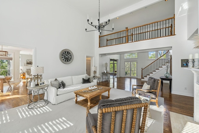 6321 Wescates, Brentwood, TN 37027 - living area featuring a chandelier, a high ceiling, wood finished floors, and baseboards