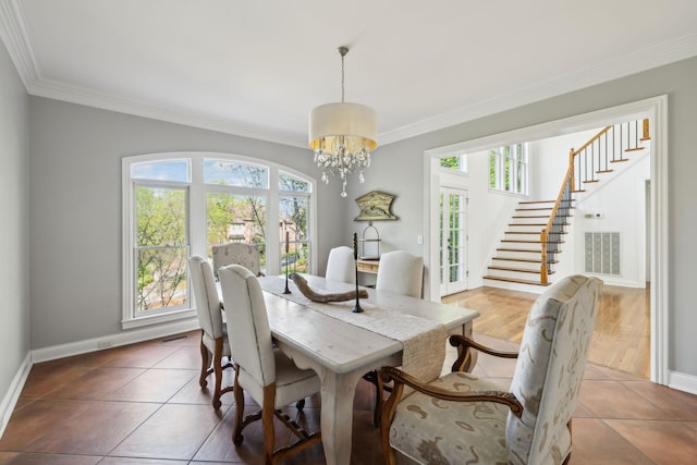 6321 Wescates, Brentwood, TN 37027 - tiled dining area featuring healthy amount of natural light, ornamental molding, a chandelier, and baseboards