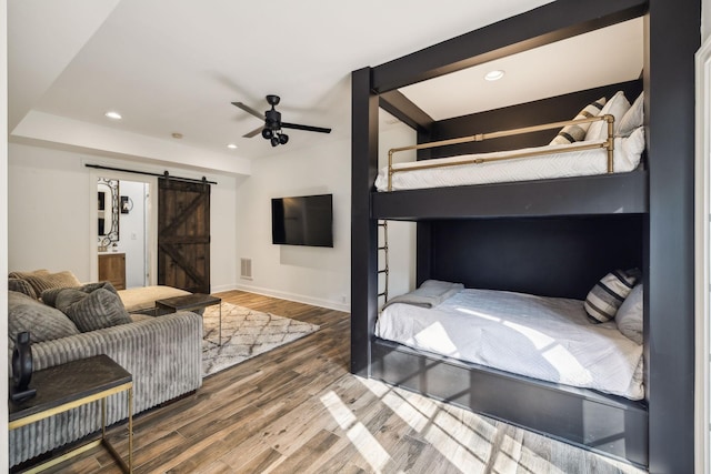 6321 Wescates, Brentwood, TN 37027 - bedroom featuring a barn door, wood finished floors, recessed lighting, baseboards, and ensuite bathroom