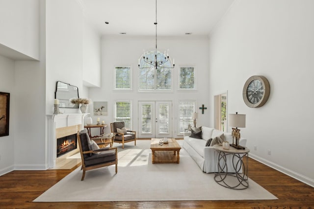 6321 Wescates, Brentwood, TN 37027 - living area featuring healthy amount of natural light, a towering ceiling, a fireplace with flush hearth, baseboards, and dark wood-style flooring