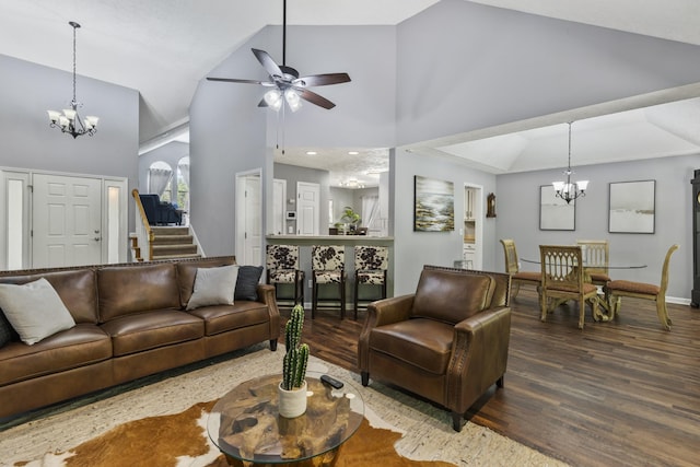 5156 W Oak Highland Dr, Antioch, TN 37013 - living area with a chandelier, wood finished floors, high vaulted ceiling, a ceiling fan, and stairs