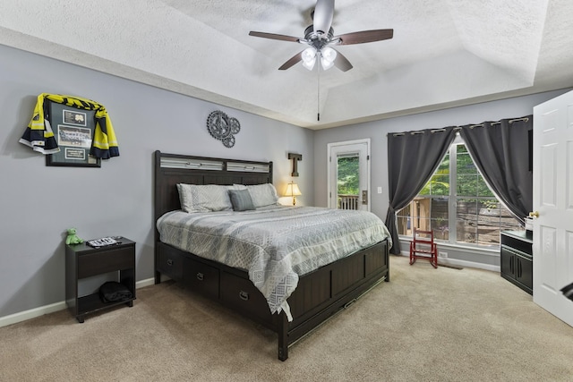 5156 W Oak Highland Dr, Antioch, TN 37013 - bedroom with light carpet, a tray ceiling, a textured ceiling, baseboards, and ceiling fan