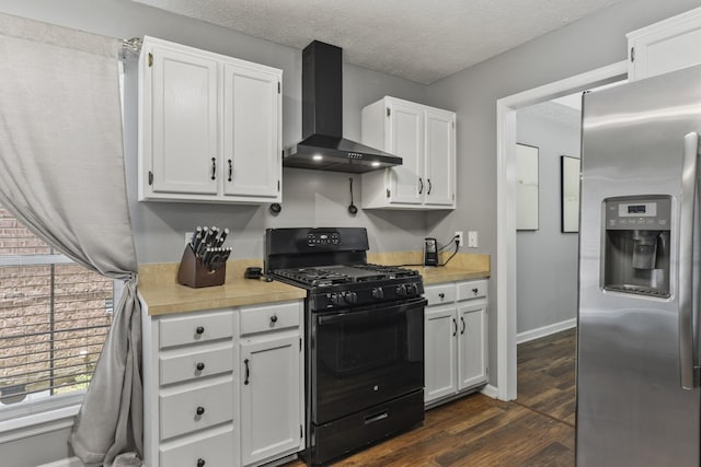 5156 W Oak Highland Dr, Antioch, TN 37013 - kitchen featuring stainless steel fridge, wall chimney exhaust hood, black gas stove, light countertops, and a textured ceiling