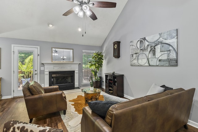5156 W Oak Highland Dr, Antioch, TN 37013 - living room with a ceiling fan, wood finished floors, vaulted ceiling, and a fireplace with raised hearth