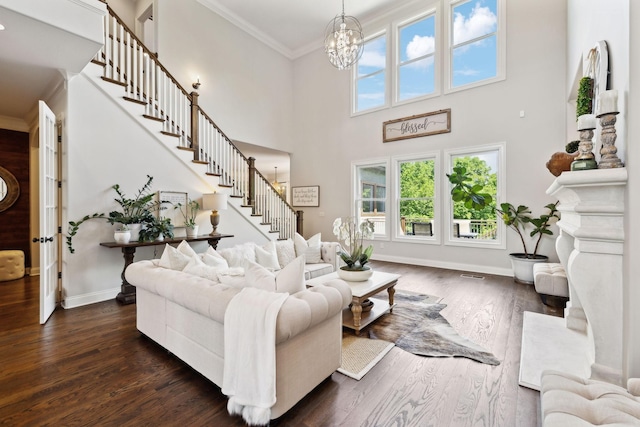 1234 Saddle Springs Dr, Thompsons Station, TN 37179 - living room featuring stairway, ornamental molding, dark wood-style floors, baseboards, and a chandelier