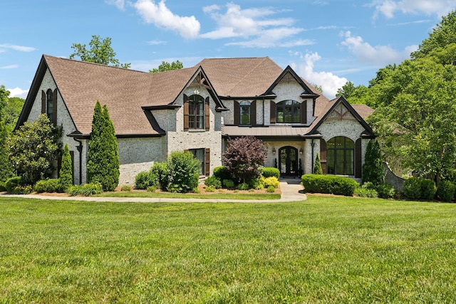 1234 Saddle Springs Dr, Thompsons Station, TN 37179 - french provincial home featuring french doors, a front yard, and a shingled roof