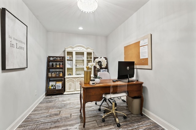 1234 Saddle Springs Dr, Thompsons Station, TN 37179 - home office with wood finished floors, baseboards, and a chandelier