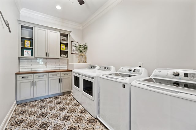 1234 Saddle Springs Dr, Thompsons Station, TN 37179 - laundry area featuring washing machine and clothes dryer, cabinet space, ornamental molding, light flooring, and a ceiling fan