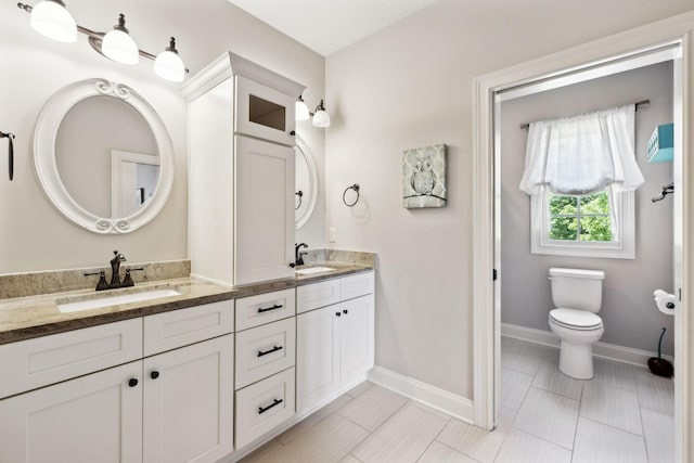 1234 Saddle Springs Dr, Thompsons Station, TN 37179 - full bath with double vanity, baseboards, and toilet