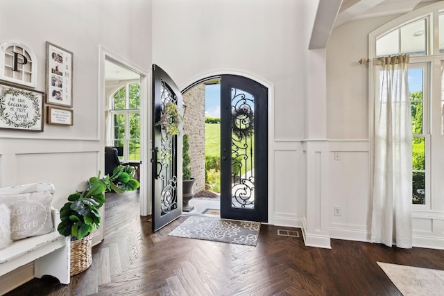 1234 Saddle Springs Dr, Thompsons Station, TN 37179 - entryway with a decorative wall, healthy amount of natural light, wainscoting, and arched walkways