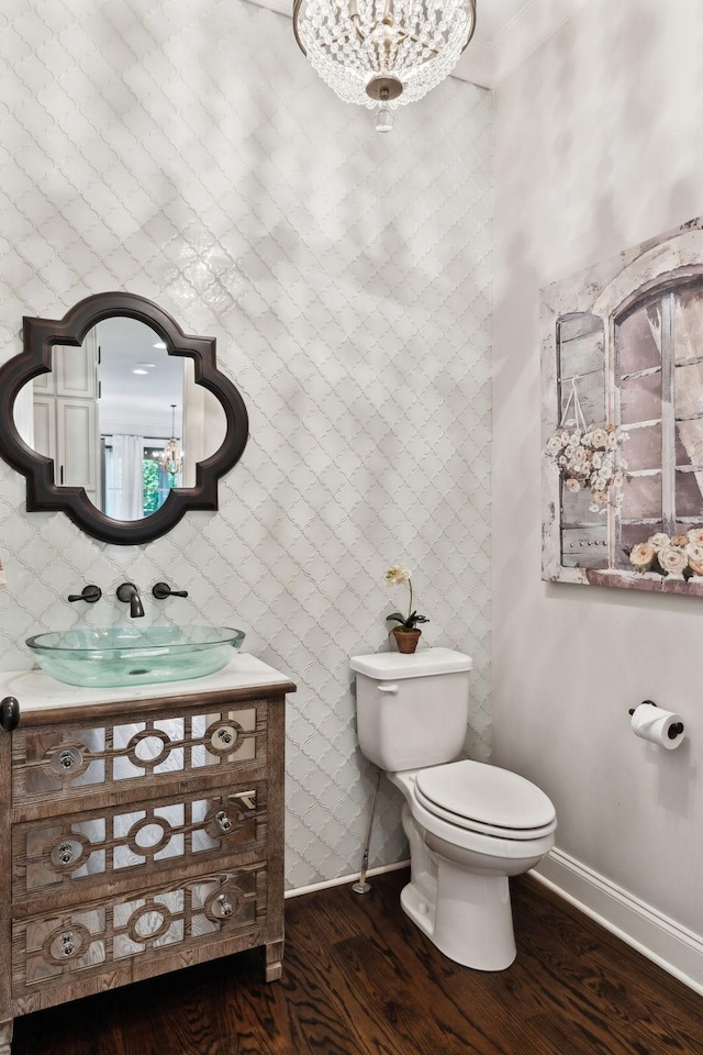 1234 Saddle Springs Dr, Thompsons Station, TN 37179 - bathroom with wood finished floors, vanity, toilet, baseboards, and a chandelier