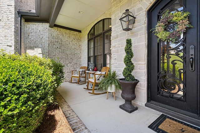 1234 Saddle Springs Dr, Thompsons Station, TN 37179 - property entrance with covered porch and brick siding