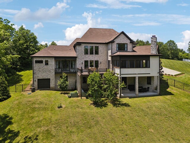 1234 Saddle Springs Dr, Thompsons Station, TN 37179 - rear view of house featuring a chimney, a patio, an attached garage, a sunroom, and stone siding