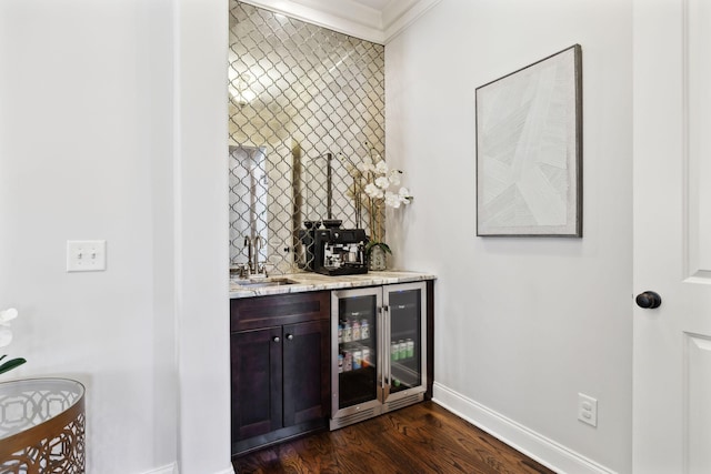 1234 Saddle Springs Dr, Thompsons Station, TN 37179 - indoor bar featuring wine cooler, baseboards, crown molding, and dark wood-style floors