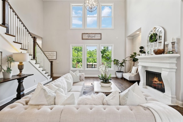 1234 Saddle Springs Dr, Thompsons Station, TN 37179 - living area featuring a high ceiling, plenty of natural light, wood finished floors, and stairs