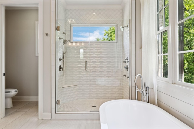 1234 Saddle Springs Dr, Thompsons Station, TN 37179 - full bathroom featuring a freestanding tub, a stall shower, toilet, and baseboards