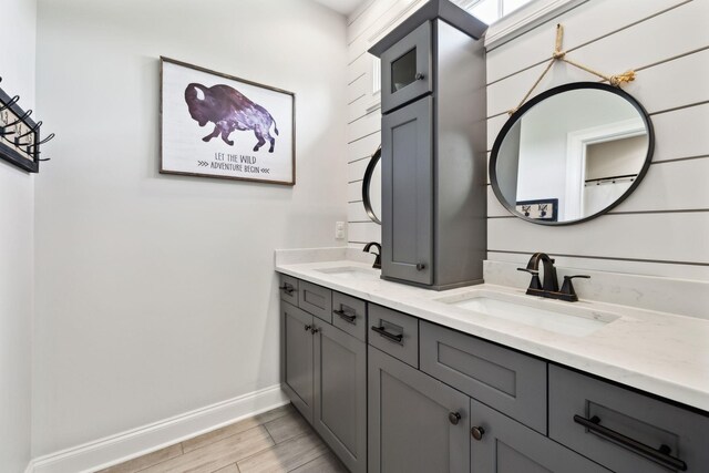 1234 Saddle Springs Dr, Thompsons Station, TN 37179 - full bath featuring baseboards, double vanity, and wood finished floors