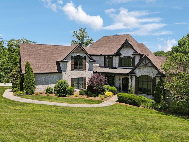 1234 Saddle Springs Dr, Thompsons Station, TN 37179 - french provincial home featuring a front yard, brick siding, and roof with shingles