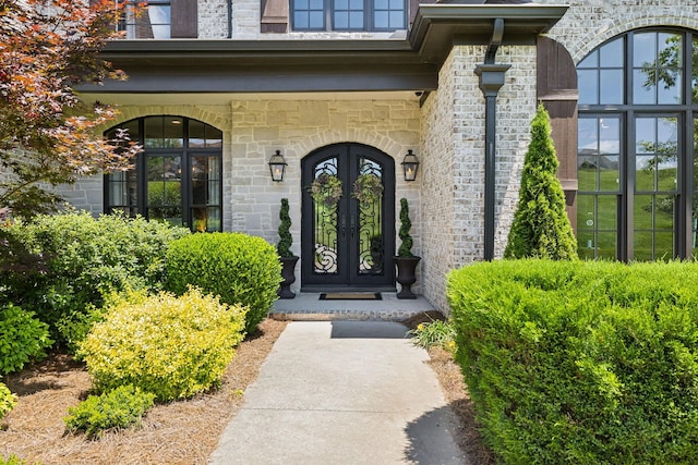 1234 Saddle Springs Dr, Thompsons Station, TN 37179 - property entrance with french doors and stone siding