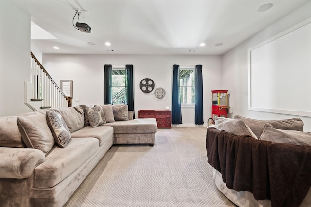 1234 Saddle Springs Dr, Thompsons Station, TN 37179 - living area featuring light colored carpet, stairway, and recessed lighting