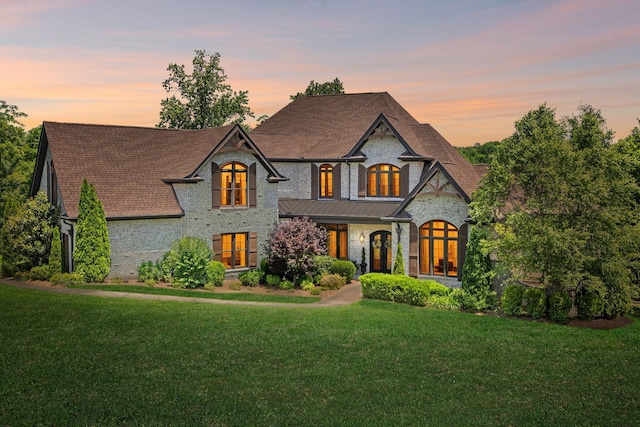 1234 Saddle Springs Dr, Thompsons Station, TN 37179 - french country home with a front lawn, a shingled roof, and brick siding