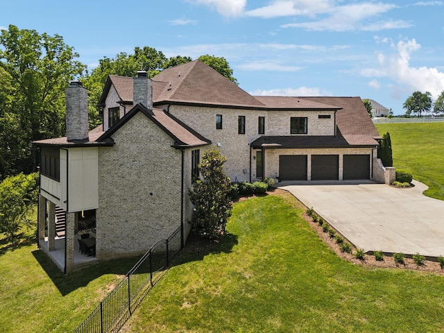 1234 Saddle Springs Dr, Thompsons Station, TN 37179 - view of front of property with a chimney, driveway, and an attached garage