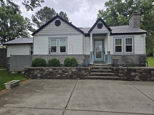 2300 Ruth St, Springfield, TN 37172 - view of front of property featuring stone siding, a chimney, and metal roof
