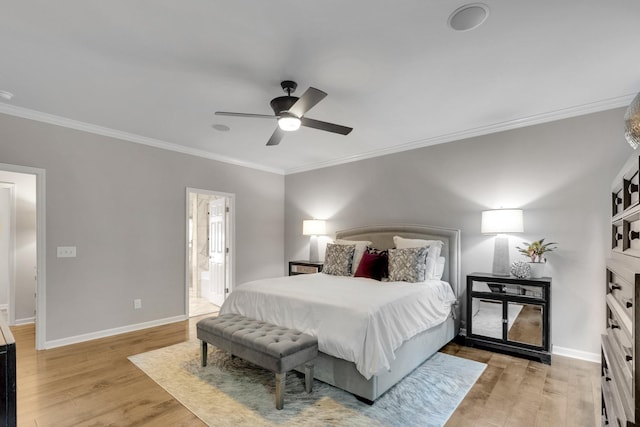 1154 Olde Cameron Ln, Franklin, TN 37067 - bedroom with crown molding, light wood finished floors, baseboards, a ceiling fan, and ensuite bathroom