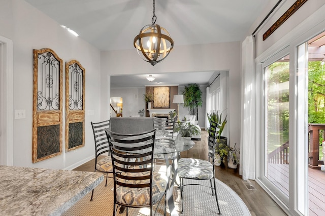 1154 Olde Cameron Ln, Franklin, TN 37067 - dining room with a chandelier, wood finished floors, and stairway