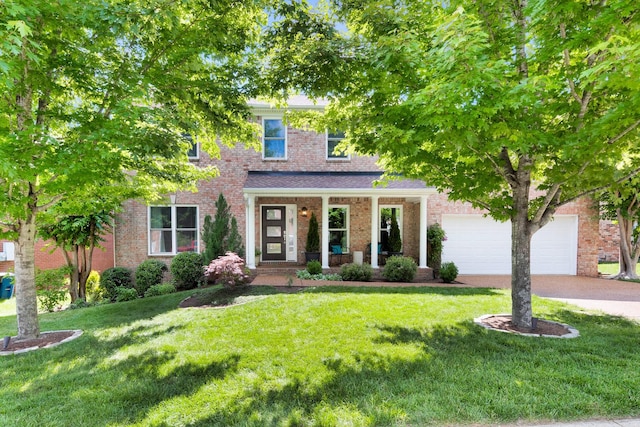1154 Olde Cameron Ln, Franklin, TN 37067 - view of front of house with driveway, a front yard, a porch, and a garage