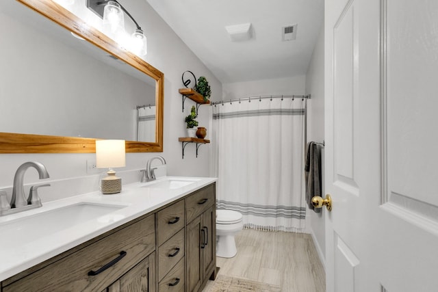 1154 Olde Cameron Ln, Franklin, TN 37067 - bathroom with double vanity, toilet, and a shower with shower curtain