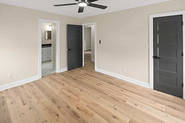 316 Bybee Branch Rd, Mcminnville, TN 37110 - unfurnished bedroom featuring light wood-style floors, baseboards, connected bathroom, and a ceiling fan