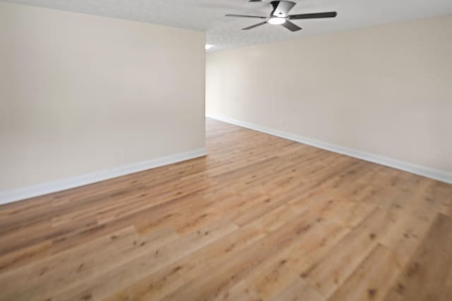 316 Bybee Branch Rd, Mcminnville, TN 37110 - empty room with baseboards, light wood-style floors, and ceiling fan