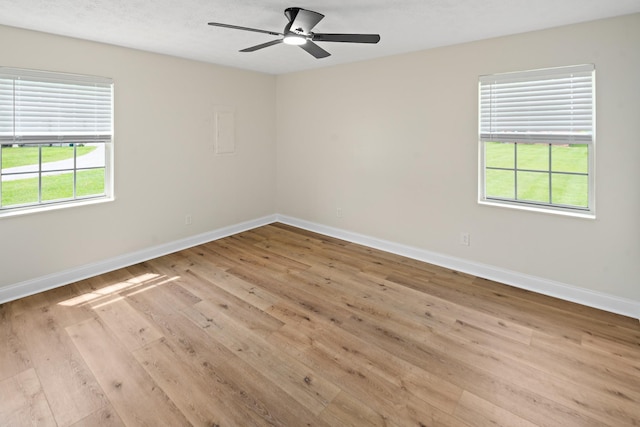 316 Bybee Branch Rd, Mcminnville, TN 37110 - spare room featuring light wood-style floors, baseboards, and a ceiling fan