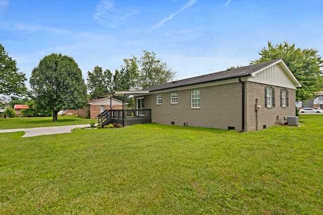 316 Bybee Branch Rd, Mcminnville, TN 37110 - back of property with a wooden deck, brick siding, a lawn, central air condition unit, and crawl space
