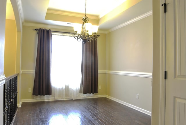3386 Cotham Ln, Clarksville, TN 37042 - unfurnished room with a chandelier, a tray ceiling, hardwood / wood-style floors, crown molding, and arched walkways